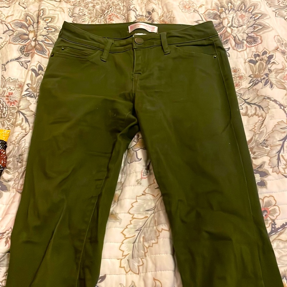 Dark greenish jeans. Not really that tight, comfy